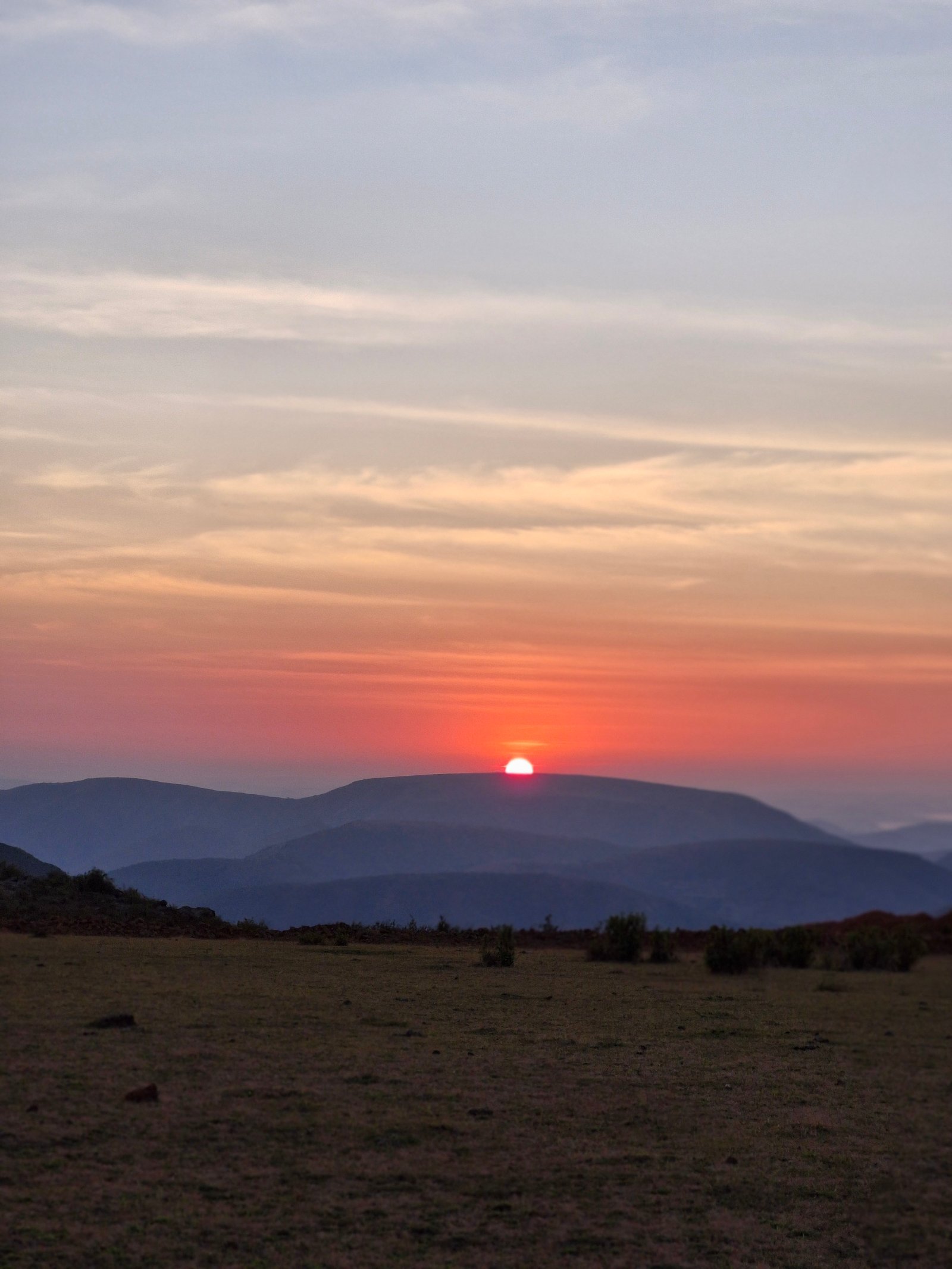 Sunrise over layered hills seen from Kalyamali hilltop, Koraput